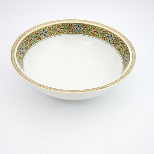 631 - A W N Pugin or Christopher Dresser for Minton, a Gothic Revival wash bowl, 1865, painted with a band... 