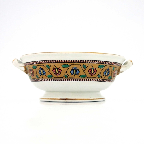 633 - Christopher Dresser for Minton, an Aesthetic Movement twin handled dish, 1865, footed and flared for... 