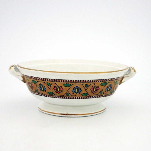 633 - Christopher Dresser for Minton, an Aesthetic Movement twin handled dish, 1865, footed and flared for... 