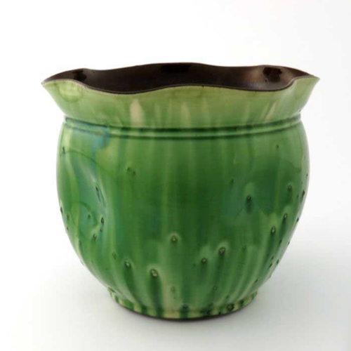 636 - Christopher Dresser for Watcombe, an art pottery jardiniere, dimpled ovoid form with flared and crim... 