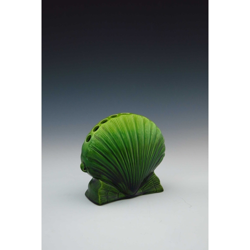 637 - Christopher Dresser for Ault, an art pottery flower vase, circa 1885, relief moulded as a shell with... 