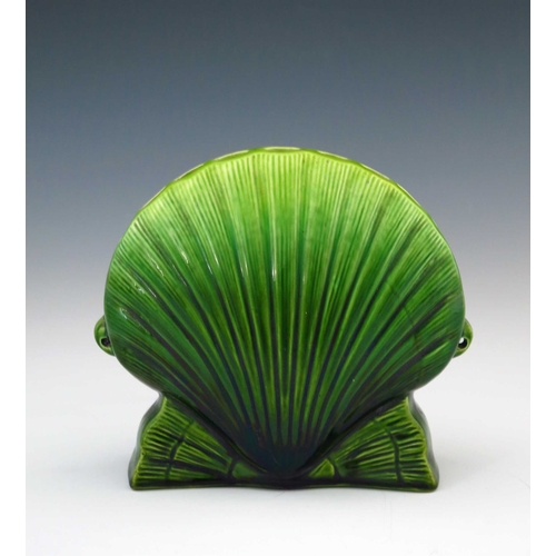 637 - Christopher Dresser for Ault, an art pottery flower vase, circa 1885, relief moulded as a shell with... 