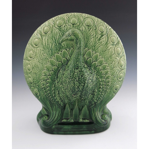 638 - Christopher Dresser for Ault, a large art pottery majolica glazed peacock vase, circa 1880, relief m... 