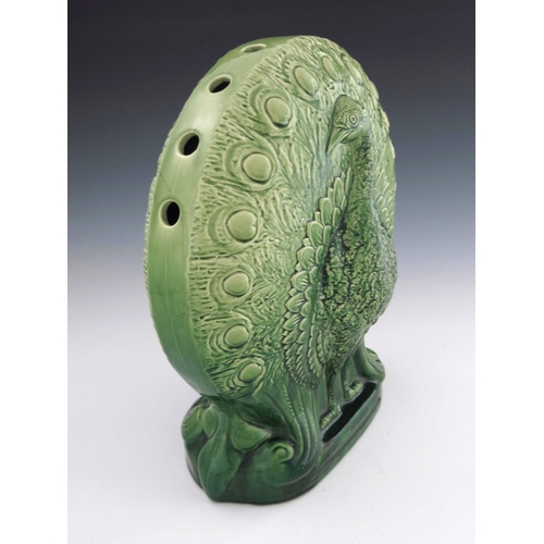 638 - Christopher Dresser for Ault, a large art pottery majolica glazed peacock vase, circa 1880, relief m... 