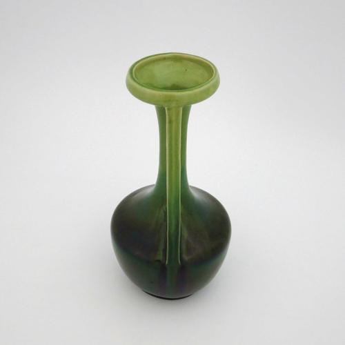 639 - A Bretby art pottery vase, twin handled bottle form, with pierced holes to the angled handles, green... 