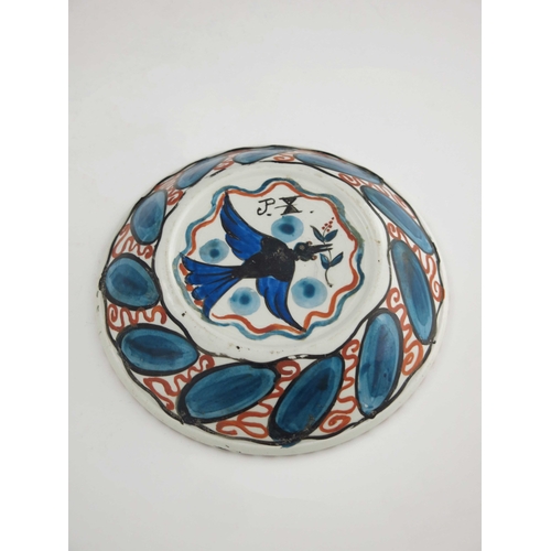 640 - John Pearson, an Arts and Crafts lustre plate, circa 1890, circular dished form, painted with a flow... 