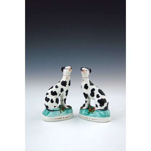 776 - A pair of mid 19th Century Staffordshire chimney dogs, circa 1860, seated with blackberry spots, Dis... 