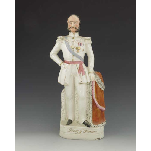 777 - A pair of Staffordshire figures of the King and Queen of Prussia, circa 1870, modelled standing on p... 