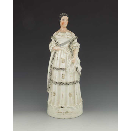 777 - A pair of Staffordshire figures of the King and Queen of Prussia, circa 1870, modelled standing on p... 