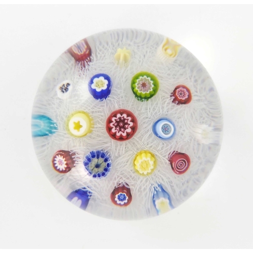 752 - Baccarat, a paperweight, scattered millefiori on lace,signature cane and dated 1974, edition number ... 