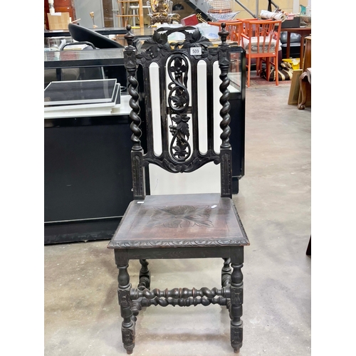 509 - A late Victorian dark stained oak side chair of Carolean design.