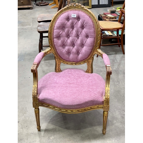 510 - A gilt framed fauteuil of Louis XVI design, pink button back upholstery.