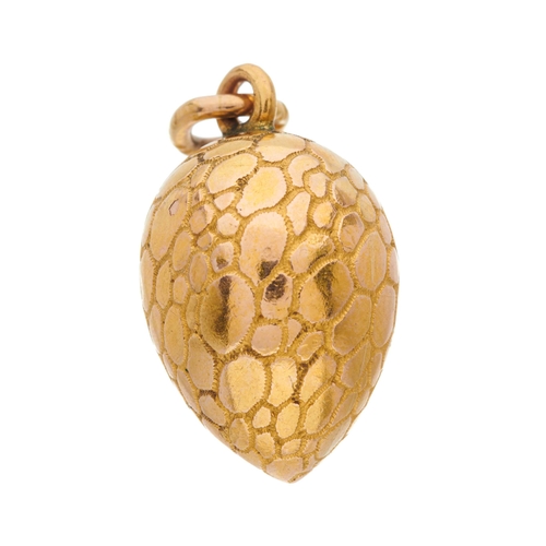 1 - A late 19th century gold egg charm pendant, with sapphire cabochon and rose-cut diamond shamrock cen... 