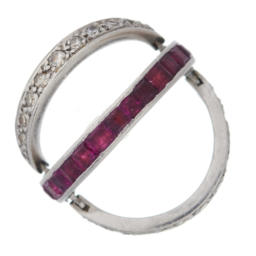 34 - An Art Deco platinum, calibre-cut ruby and sapphire full eternity swivel ring, with single-cut diamo... 
