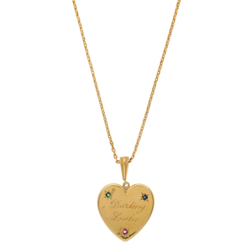 39 - An 18ct gold ruby, sapphire and emerald accent heart-shape pendant, the front engraved 'Darling Lulu... 