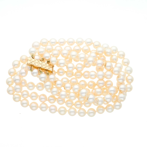 40 - A three-row cultured pearl choker necklace, with 14ct gold sliding clasp, pearls measure approximate... 