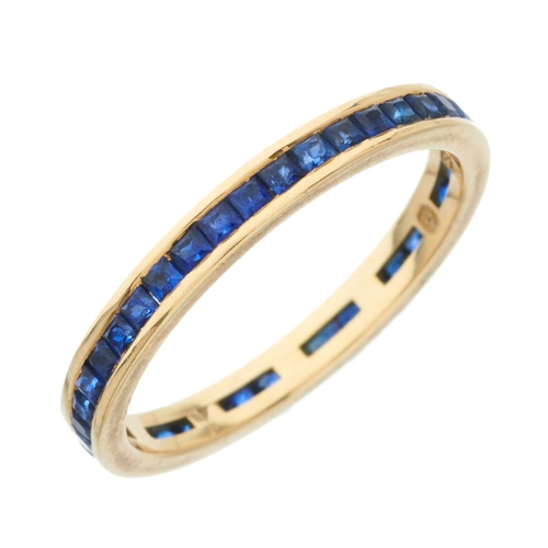 54 - An 18ct gold calibre-cut sapphire full eternity ring, estimated total sapphire weight 1ct, hallmarks... 