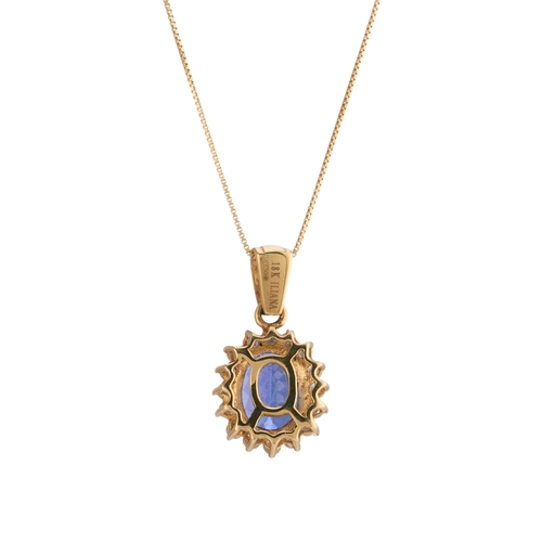 68 - An 18ct gold tanzanite and brilliant-cut diamond cluster pendant, suspended from an 18ct gold box-li... 