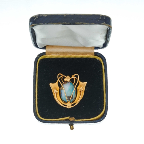 86 - An 18ct gold black opal cabochon and brilliant-cut diamond pendant, suspended from an early 20th cen... 