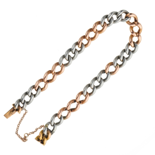 92 - An early 20th century 15ct gold and platinum curb-link bracelet, of bi-colour design, with partially... 