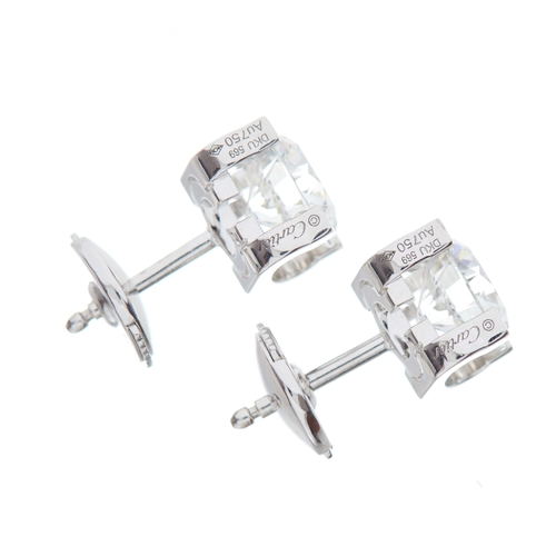 166 - Cartier, a pair of 18ct gold brilliant-cut diamond C de Cartier single-stone stud earrings, total di... 