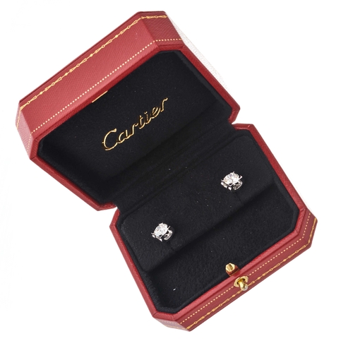 166 - Cartier, a pair of 18ct gold brilliant-cut diamond C de Cartier single-stone stud earrings, total di... 