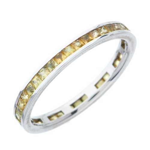 179 - An 18ct gold calibre-cut yellow sapphire full eternity ring, estimated total yellow sapphire weight ... 