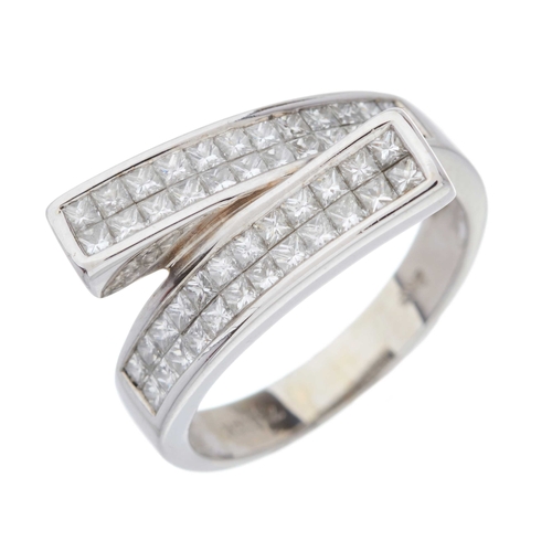 213 - An 18ct gold diamond dress ring, designed as two calibre-cut diamond panels, with slightly tapered b... 