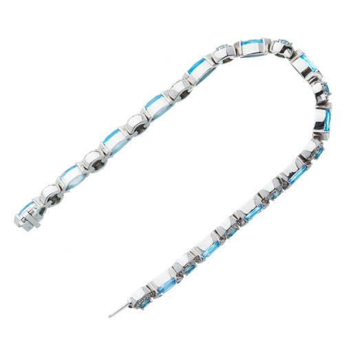 216 - A 14ct gold blue topaz and brilliant-cut diamond cluster line bracelet, with marquise-shape blue top... 