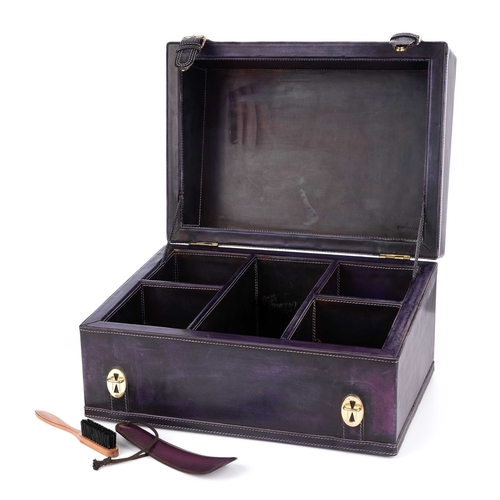 273 - Berluti, a leather shoe cleaning case, featuring a distressed purple leather exterior, with a flat t... 