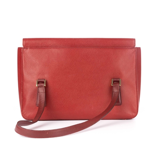 283 - Burberry, a red medium flap handbag, designed with grained red leather exterior, with gold-tone hard... 