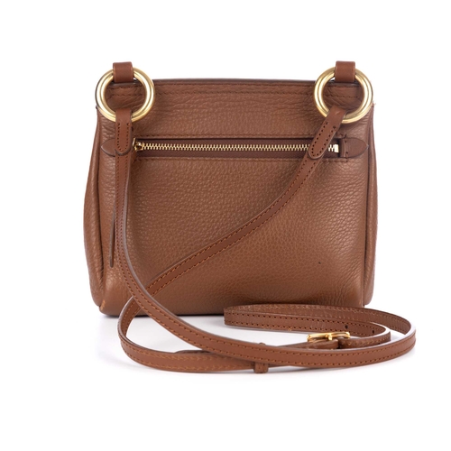 289 - Burberry, a small crossbody saddle bag, crafted from tan leather with bushed gold-tone hardware acce... 