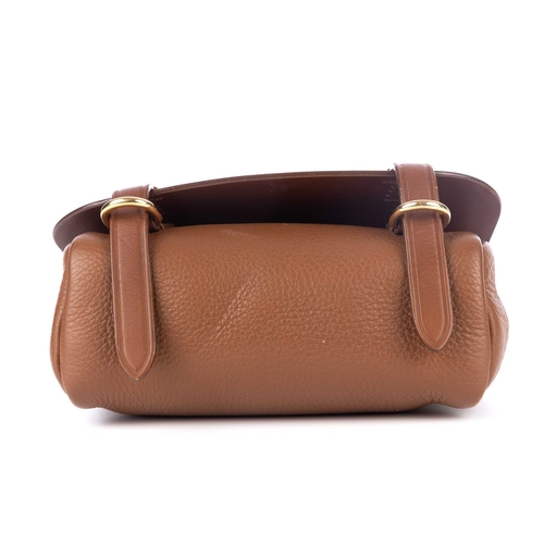 289 - Burberry, a small crossbody saddle bag, crafted from tan leather with bushed gold-tone hardware acce... 