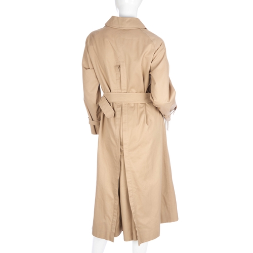 292 - Burberry, a ladies classic trench coat, featuring front button fastenings, a waist belt and the make... 