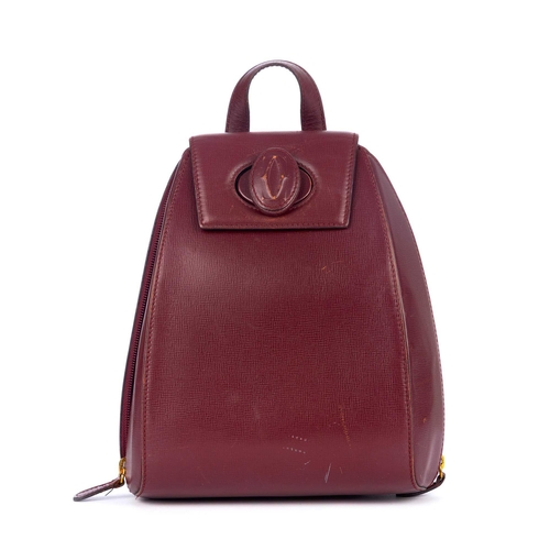 300 - Cartier, a Bordeaux leather backpack, crafted from grained burgundy leather, designed with a sleek, ... 