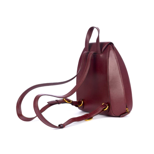 300 - Cartier, a Bordeaux leather backpack, crafted from grained burgundy leather, designed with a sleek, ... 