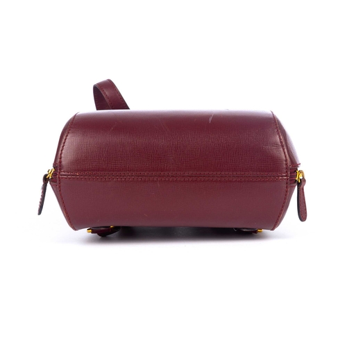 300 - Cartier, a Bordeaux leather backpack, crafted from grained burgundy leather, designed with a sleek, ... 