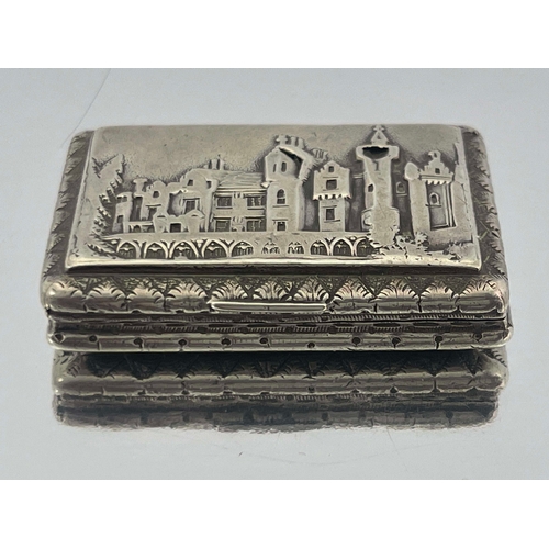 144 - A silver castle top vinaigrette, George Wish, London, cast and chased with Abbotsford house within f... 