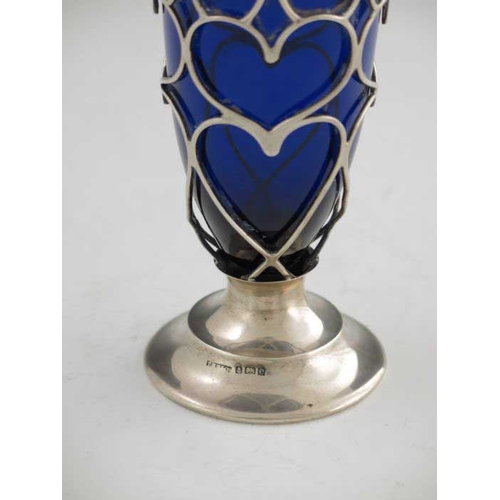 152 - An Edwardian silver reticulated caster, T H Hazelwood and Co., Birmingham 1904, footed, with heart f... 