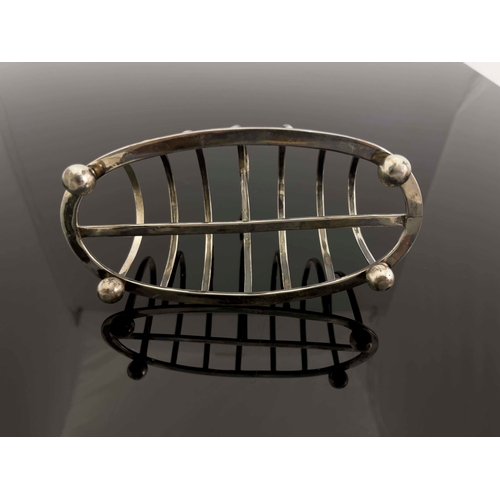 157 - A large Victorian silver six division toast rack, Josiah Williams and Co., London 1898, the oval fra... 