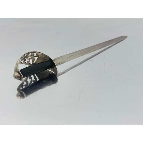 159 - A George V novelty silver letter opener, James Fenton, Birmingham 1915, in the form of an officer's ... 