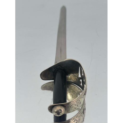 159 - A George V novelty silver letter opener, James Fenton, Birmingham 1915, in the form of an officer's ... 