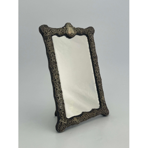 162 - A Victorian silver framed mirror, Henry Matthews, Birmingham 1899, rectangular cartouche form, the b... 