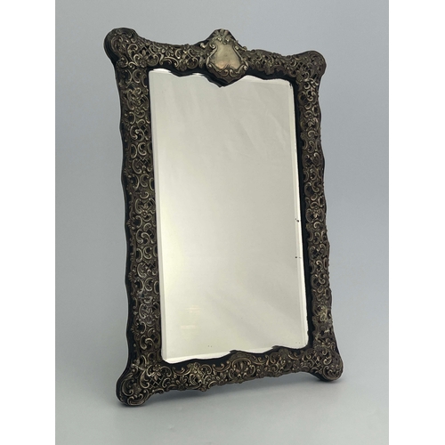 162 - A Victorian silver framed mirror, Henry Matthews, Birmingham 1899, rectangular cartouche form, the b... 