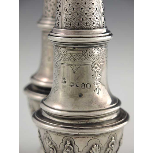 164 - A pair of Victorian silver casters, Robert Garrard II, London 1856, cast baluster form, engraved wit... 