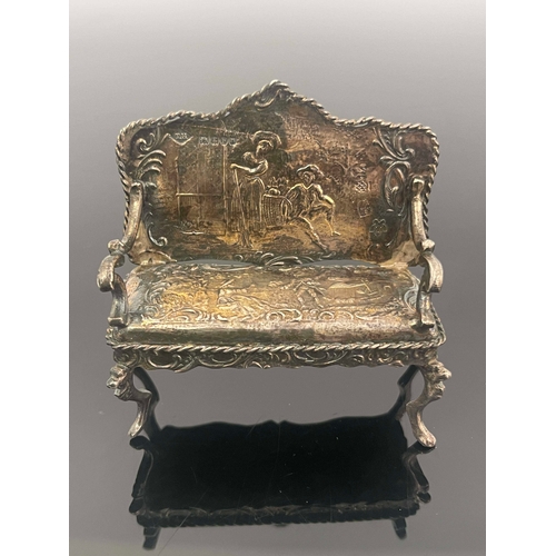 170 - An Edwardian silver miniature settee, Theodor Hartmann, London 1902, chased with scenes after Wattea... 