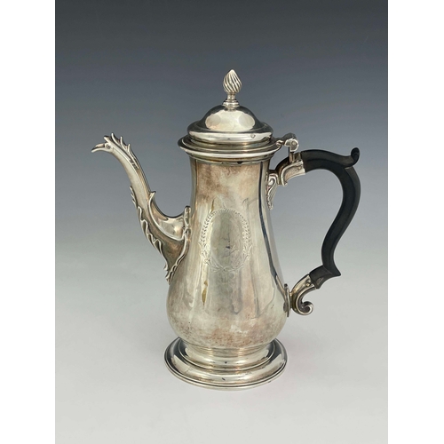 176 - A George III silver coffee pot, IC, London 1765, footed baluster form with cast flame foliate cabrio... 