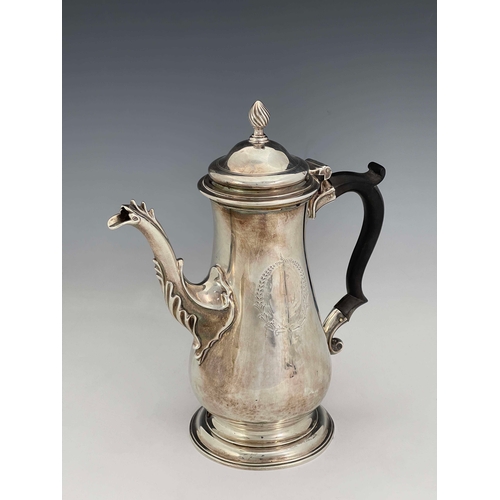 176 - A George III silver coffee pot, IC, London 1765, footed baluster form with cast flame foliate cabrio... 