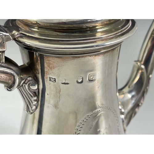 176 - A George III silver coffee pot, IC, London 1765, footed baluster form with cast flame foliate cabrio... 