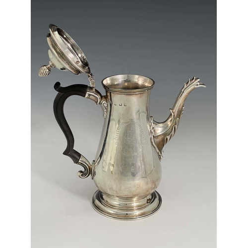 176 - A George III silver coffee pot, IC, London 1765, footed baluster form with cast flame foliate cabrio... 